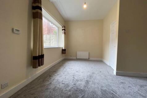 Bright and clean small room featuring a window ...
