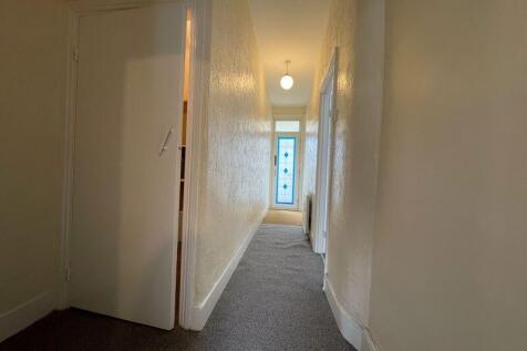 A clean and well-maintained hallway featuring n...