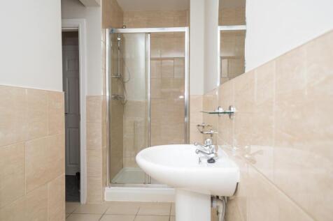 A clean and modern bathroom featuring a spaciou...