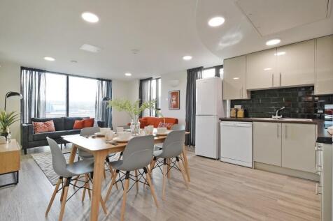 Bright and modern open-plan living area featuri...