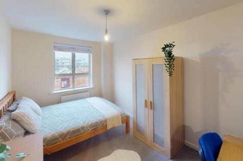Bright and inviting double bedroom featuring a ...