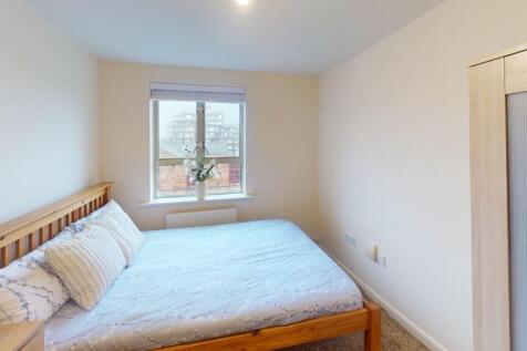 Bright and cozy double bedroom featuring a comf...