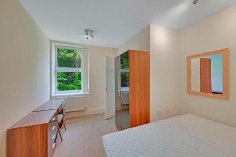 Bright and spacious master bedroom featuring a ...