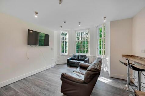 A stylish living room featuring comfortable lea...