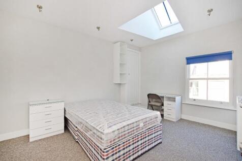 Bright and airy single bedroom featuring a comf...
