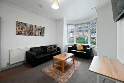 Bright and cozy living room featuring comfortab...