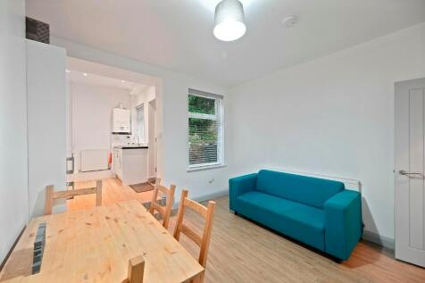 Bright and modern living space featuring a comf...