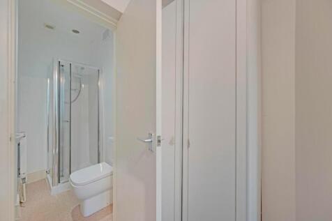 Bright and modern bathroom featuring a spacious...