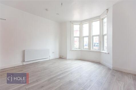 A bright and spacious double bedroom featuring ...