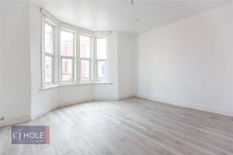 Bright and airy double bedroom featuring a larg...