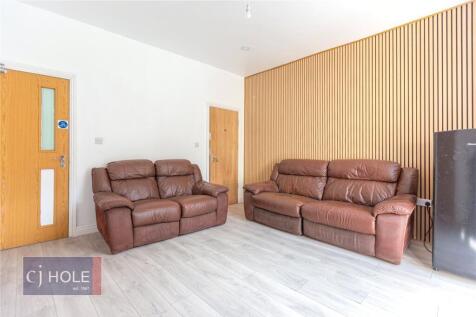 Contemporary living room featuring two comforta...