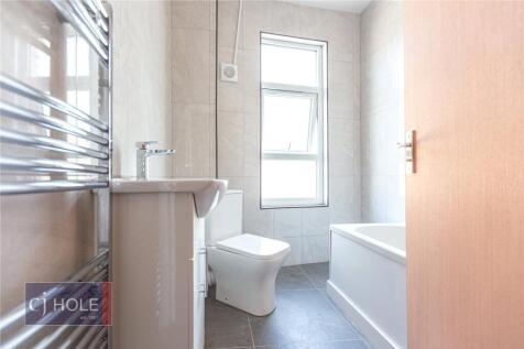 Bright and clean bathroom featuring a modern wh...