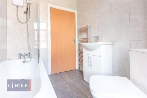 A modern and clean bathroom suite featuring a b...