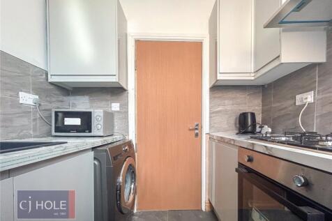 Modern kitchen featuring stainless steel applia...
