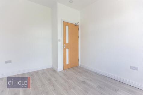 A bright and clean empty room with fresh white ...