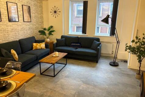 A modern and inviting living room featuring two...