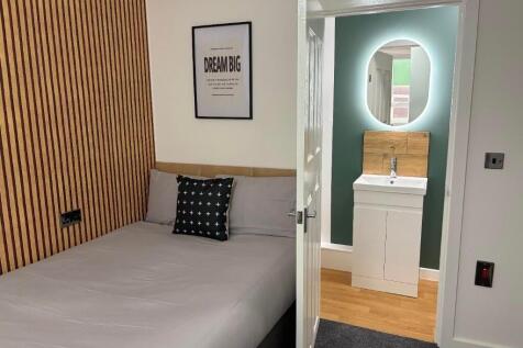 A modern double bedroom featuring a comfortable...