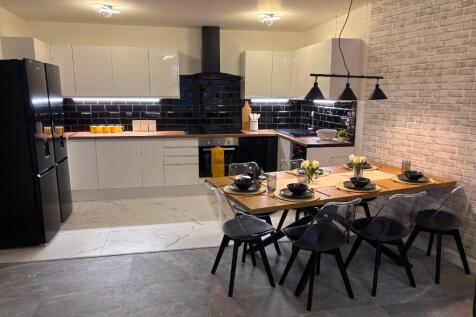 Modern, well-equipped kitchen featuring sleek w...