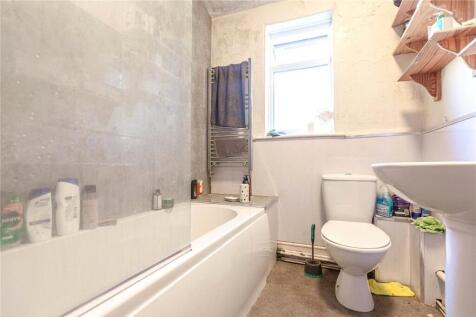 Bright and clean bathroom featuring a full-size...