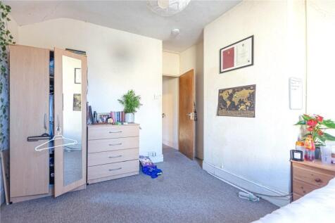Bright and clean room featuring a wardrobe, che...