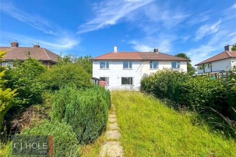 Bright and inviting front view of a charming se...