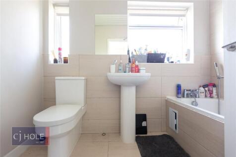 Bright and modern bathroom featuring a clean wh...
