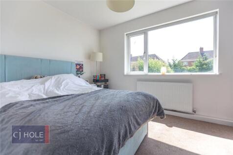 Bright and cozy double bedroom featuring a comf...