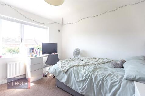 Bright and cozy single bedroom featuring a comf...