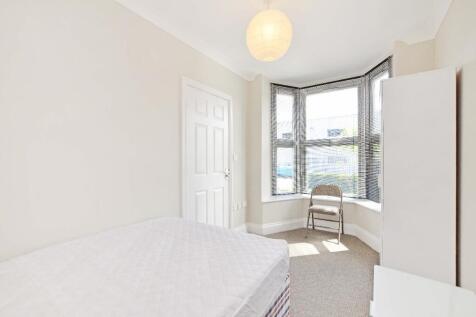 Bright and airy double bedroom featuring a larg...