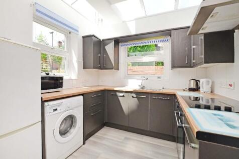 Bright and modern kitchen with ample countertop...