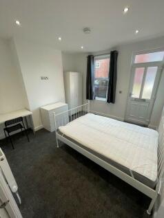 Bright and tidy double bedroom featuring a stur...