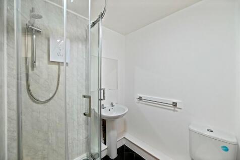 Bright and clean bathroom featuring a modern co...