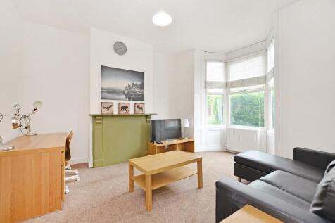 Bright and welcoming living room featuring a la...