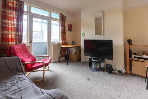 A cozy living room featuring a comfortable sofa...