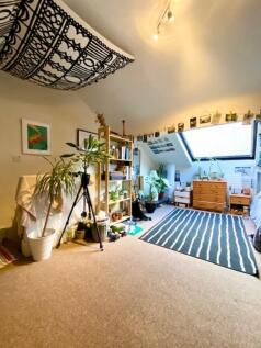 Bright and airy master bedroom featuring a slop...
