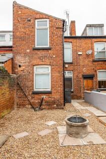 A charming private garden space featuring a gra...