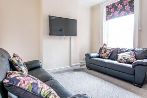 A cozy living room featuring two comfortable bl...
