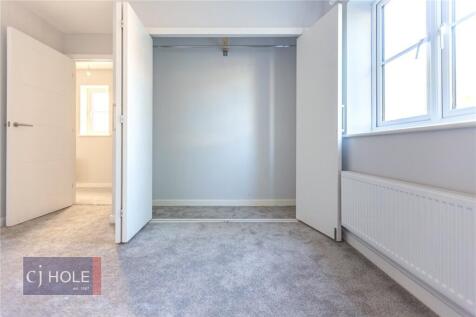 Bright and clean double bedroom featuring a lar...