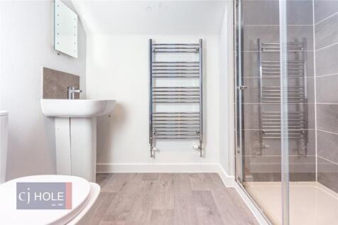 A modern, clean bathroom featuring a spacious w...