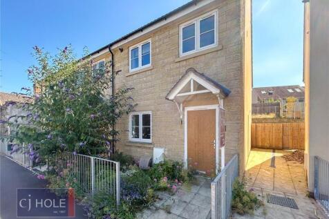 Charming terraced house exterior featuring clea...