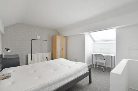 Bright and inviting master bedroom featuring a ...