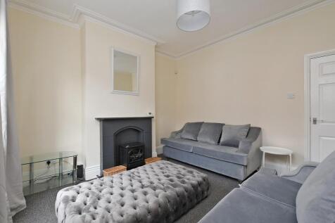 A contemporary living room featuring comfortabl...