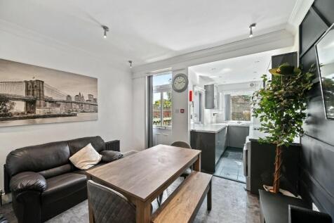A modern living room featuring a comfortable bl...