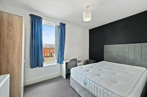 Bright and neat double bedroom featuring a larg...