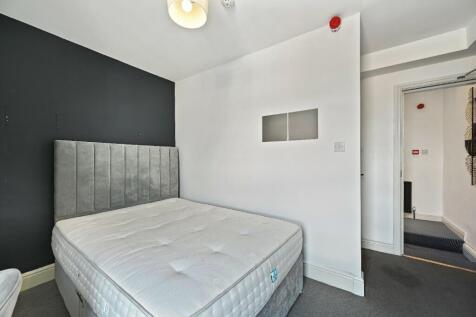 A modern double bedroom featuring a comfortable...