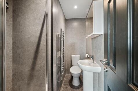 A modern and well-maintained bathroom featuring...