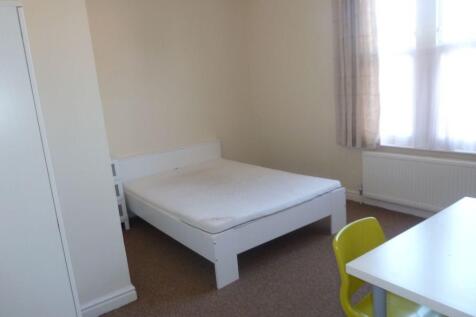 A bright and tidy double bedroom featuring a wh...