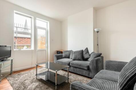 Bright and contemporary living room featuring c...