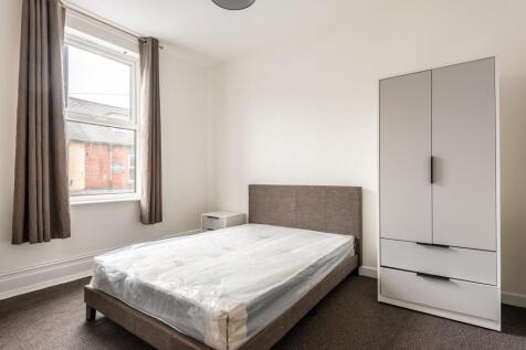 Bright and tidy double bedroom featuring a larg...