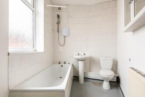 Bright and clean bathroom featuring a full-size...